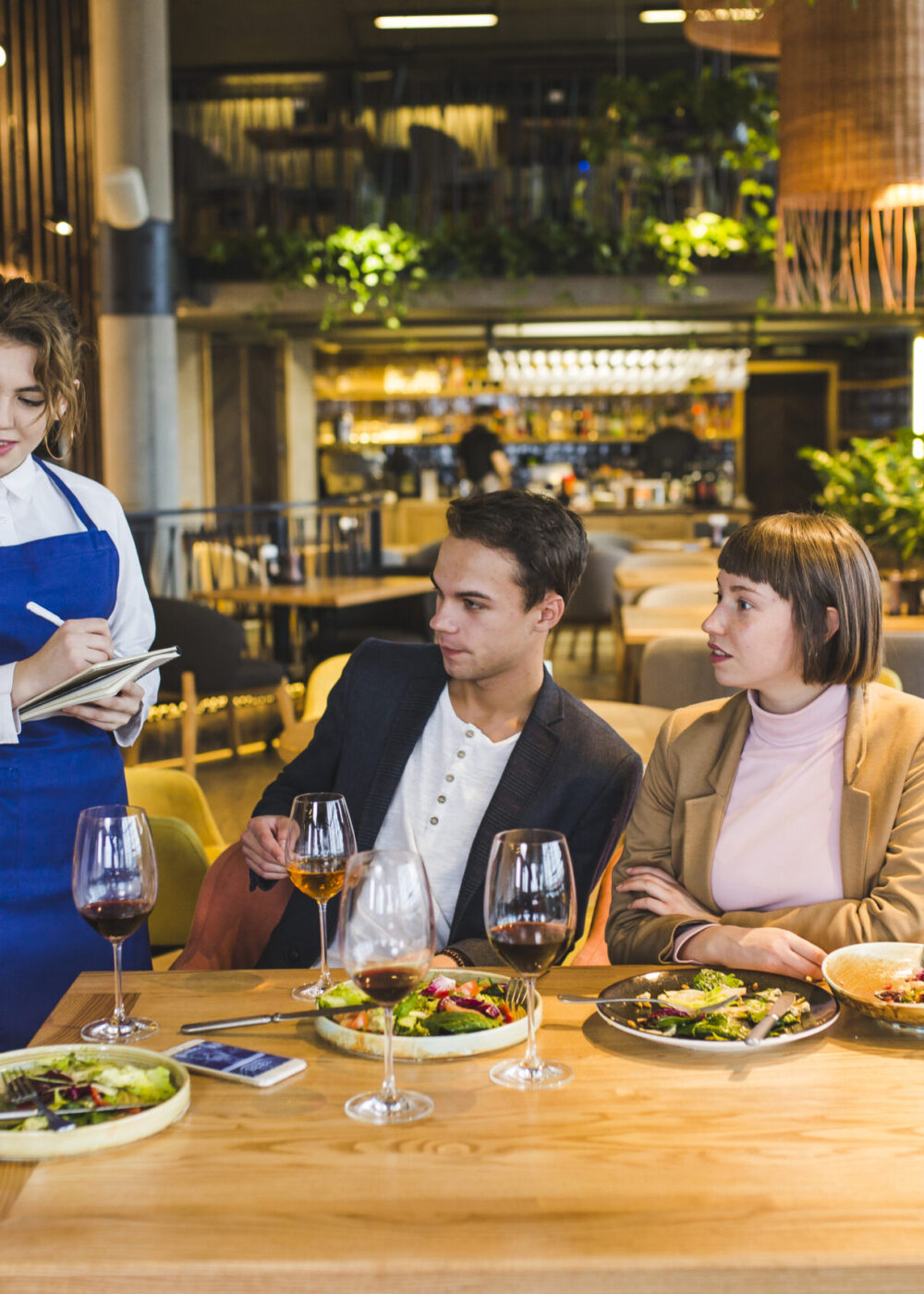 group-friends-eating-restaurant